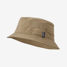 This packable, durable and breathable bucket hat is built of quick-drying NetPlus® 100% postconsumer recycled nylon faille made from recycled fishing nets to help reduce ocean plastic pollution, with a durable water repellent (DWR) finish made without perfluorinated chemicals (PFCs/PFAS). It keeps the sun off without getting soggy or stuffy on hot days. Made in a Fair Trade Certified™ factory. | Patagonia Wavefarer™ Bucket Hat in Mojave Khaki, Large/XL - Full Brim Hats - Nylon