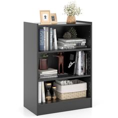 a bookcase with books and pictures on top of it, in front of a white background