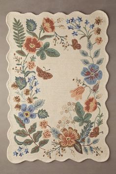 a rug with flowers and leaves on it