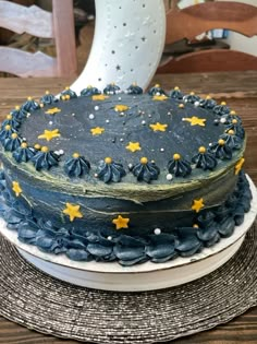 a blue and yellow cake with stars on it