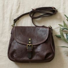 Cheap Light Brown Crossbody Bag, Cheap Vintage Natural Color Shoulder Bag, Brown Satchel With Pockets For Fall, Brown Fall Satchel With Pockets, Brown Saddle Bag For Daily Use In Fall, Brown Saddle Bag With Removable Pouch For Fall, Everyday Brown Saddle Bag With Phone Pocket, Brown Crossbody Saddle Bag With Cell Phone Pocket, Brown Shoulder Bag With Cell Phone Pocket For Fall