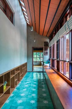 the inside of a house with blue and green flooring