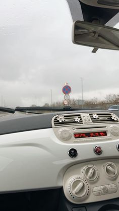 the dashboard of a car on a highway