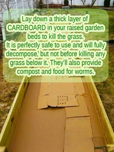 a wooden boat sitting on top of a grass covered field