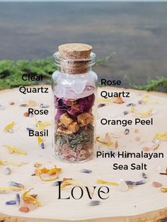 Love spell jar photo with labels of what is inside- clear quartz, rose quartz, rose, orange peel, Basil, pink Himalayan sea salt Mini Spell Jars Diy, Love Spell Jar Ingredients, Love Spell Jar Recipe, Simple Spell Jars, Spell Jars Love, Healing Spell Jars Recipes, Motivation Spell Jar, Small Spell Jar, Spell Jars Witchcraft