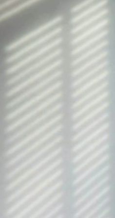 a blurry photo of the blinds on a window