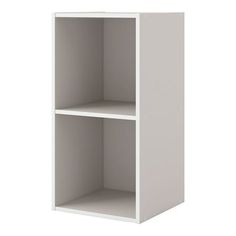 a white bookcase with two shelves on each side and one shelf above the other