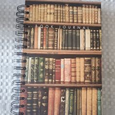 the book journal is full of books on top of each other, and it's lined with old books