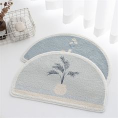 three bathroom rugs with palm trees on them