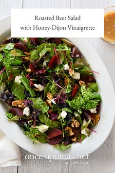 roasted beet salad with honey - dijon vinagrete on a white plate