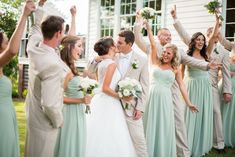 a bride and groom are surrounded by their bridal party