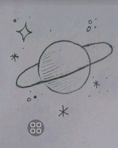 a drawing of the planet saturn drawn on paper with stars around it and an object in the background