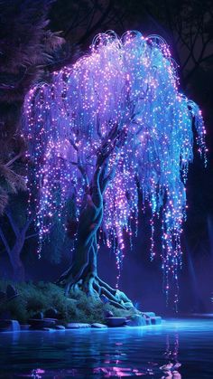 a tree that is next to some water with lights on it in the night time