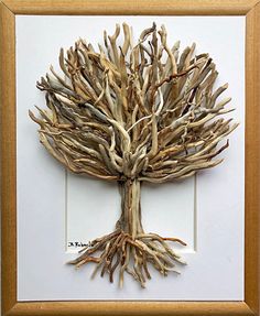 a tree made out of branches in a frame