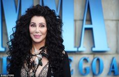 a woman with long black hair standing in front of a blue sign that says,'avatar