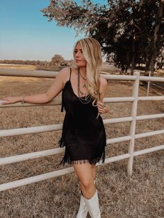 One Chance Fringe Dress Fringe Romper With Boots, Black Fringe Dress Western, Fancy Country Concert Outfit, Fringe Dress With Cowboy Boots, Western Hoco Dress With Boots, Western Hoco Dresses, Black Dress With Cowgirl Boots, Western Cocktail Dress, Black Cowboy Boots Outfit Concert