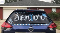 a car that has been decorated with the word senior on it's back window