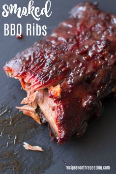 bbq ribs with barbecue sauce on top and the words smoked bbq ribs above it