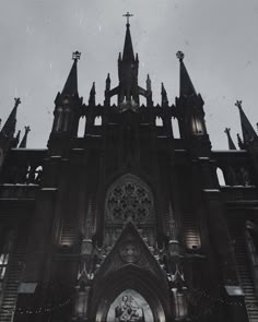 an old photo of a gothic church in the snow