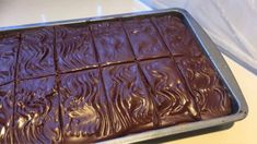 a pan filled with chocolate sitting on top of a counter