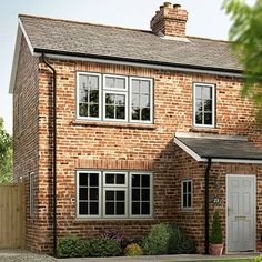 an artist's impression of a brick house with white windows and doors on the front