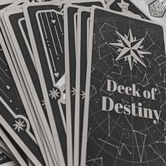 deck of destiny playing cards are stacked on top of each other in black and white