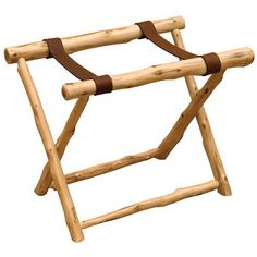 a wooden rack with two leather straps on the top and bottom, made out of logs