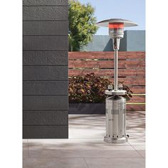 an outdoor heater sitting on top of a patio