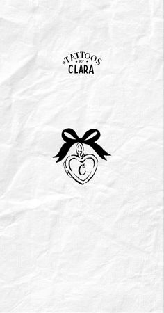 the cover to tattoos clara's book, with an apple on it and a bow