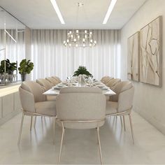 a dining room table with white chairs and a chandelier hanging from the ceiling