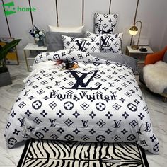 the louis vuitton bedding set is made up with zebra print and black letters