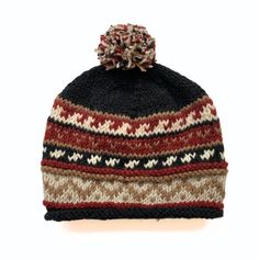 This 100% wool stocking hat keeps you warm and looking good . It is fully lined with soft fleece. It's sure to be a great look on both men and women. Handmade in Nepal Materials: 100% wool (outer), polar fleece (interior) One size fits most Cold water hand wash (or dry clean); lay flat to dry With every product you purchase, you are helping provide employment, educational opportunities and medical care to artisans in Nepal. Wool Bonnet For Cold Weather, Winter Wool Bonnet For Cold Weather, Warm Wool Bonnet For Winter, Warm Wool Bonnet For Fall, Warm Wool Winter Bonnet, Black Wool Hats For Cold Weather, Red Warm Outdoor Hat, Warm Red Hat For Outdoor, Warm Red Outdoor Hat