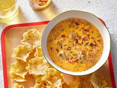 a bowl of soup with tortilla chips on the side