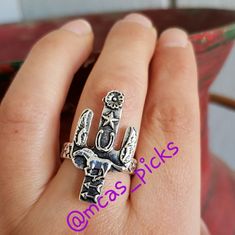 This Gorgeous Adjustable Cactus Ring Is Adorned With A Flower, Star, Horseshoe, Angel Wings, Running Horse, And Arrows. Floral Details On The Sides. Just Beautiful. Please Note That Due To The Lighting The Color Might Differ. Coloring Might Differ A Little Depending On The Ring You Receive. Nwot # Horse Pony Cowboy Cowgirl Vaquera Vaqueras Foal Colt Country Ranch Life Rancho Farm Life Granja Animal Caballo Caballos Angel Wings Bull Rider Native American Vaquero Vaqueros Cosas De Rancho Equestria Cowgirl Rings, Horseshoe Angel, Flower Arrow, Layering Rings, Texas Cactus, Horse Flower, Cactus Ring, Steer Head, Horse Flowers