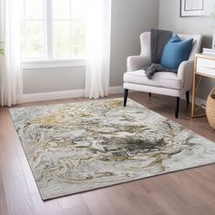 a living room with a chair, rug and window