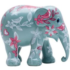 an elephant figurine with pink flowers and birds painted on it's body