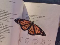 an open book with a butterfly sitting on it's cover and the pages showing phases of a butterfly