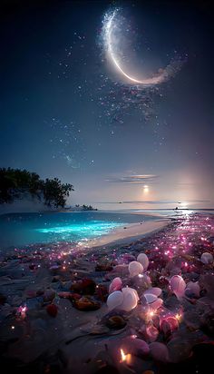 a beach covered in lots of pink and white balloons next to the ocean at night