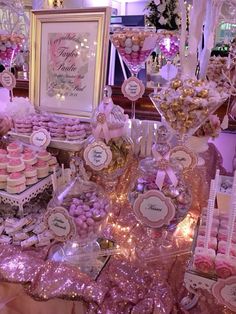 a table topped with lots of desserts and candies