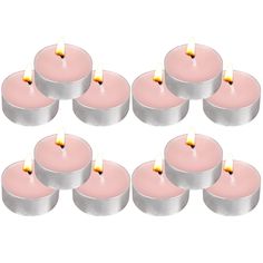 six pink candles sitting next to each other