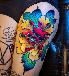 two colorful tattoos on the legs of women