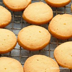 some cookies are cooling on a rack and ready to be baked in the oven for consumption