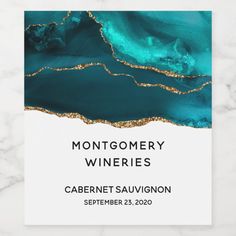 a white and blue poster with gold foil on it that says montgomery wineries cabernet sauvignon