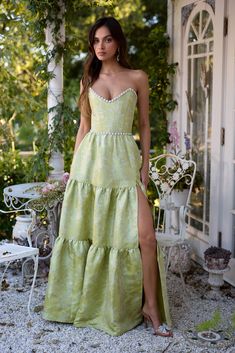 Introducing The Vivian Dress! She's the dreamiest strapless gown, accented with sparkling pearl and crystal beaded trim. Fall in love with cascading gathered tiers and a sexy, but sophisticated, side-front slit. Made in Chartreuse Windsor Brocade, which flaunts chartreuse florals on a chartreuse background, she features a corset bodice, invisible zipper, and side pockets. Dance days and nights away in this brocade dream. Gayeanne is 5'9 and is wearing a size 00. Please note color shade may vary Chartreuse Bridesmaids Dresses, Chartreuse Background, Chartreuse Dress, Vivian Dress, Brocade Dress, Dancing Day, Brocade Dresses, Corset Bodice, Senior Prom