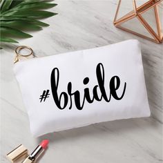 the bride makeup bag is next to some lipstick