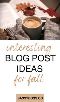 an open book and cup of coffee on top of a table with autumn leaves in the background