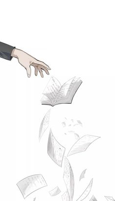 a hand reaching for an open book flying through the air with papers all over it