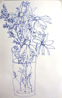 a drawing of flowers in a vase on top of a piece of paper with blue ink