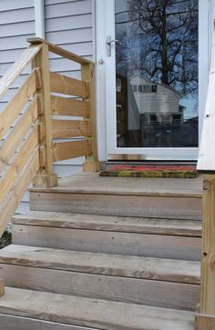 wooden steps leading up to a front door