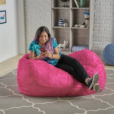 Includes: One (1) beanbag chair Material: Polyester fabric Fill material: Foam Color options: Kiwi green, fuchsia pink, red, or purple Closure: Double zipper Care instructions: Cold wash, removable cover Weight: 20-pounds Dimensions: 26 inches high x 46 inches wide x 34 inches wide Hot Pink Bean Bag, Giant Pink Bean Bag, Pink Beanbag Couch, Tv Game Room, Alternative Seating, Bean Bag Lounger, Bean Bag Cover, Bean Bag Covers, Cozy Pillow